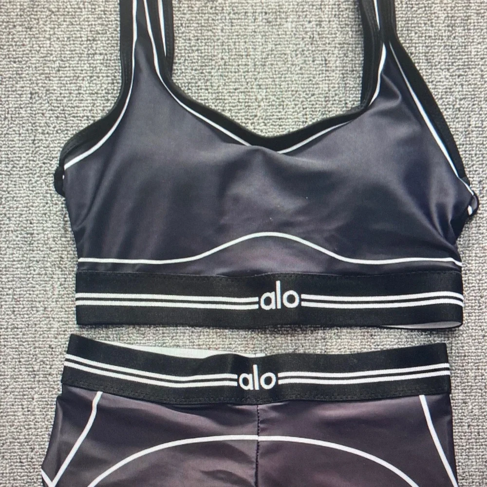 ALO Yoga Black Leggings with White Piping Detail